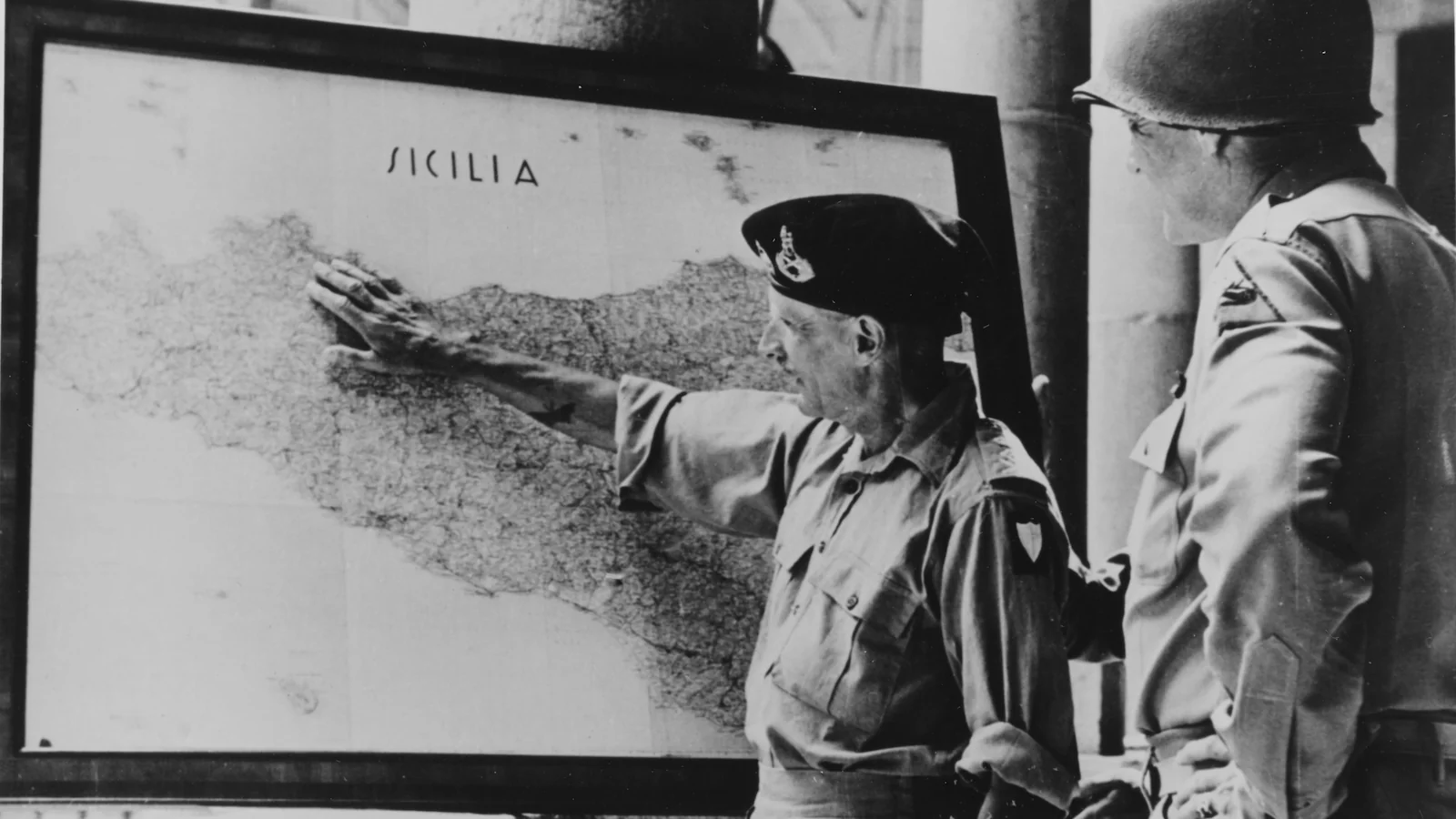 General Montgomery and Lieutenant General Patton studying a map of Sicily during the Allied campaign in 1943.