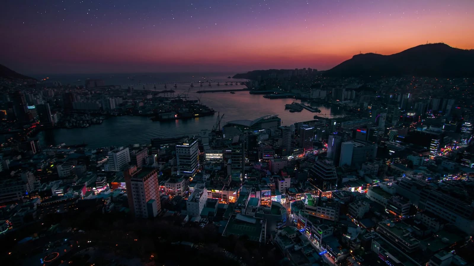 Stunning nighttime view of Busan and Haeundae Beach, one of South Korea’s most vibrant coastal cities and a major stop on Essential History Expeditions’ Korea history and culture tour.