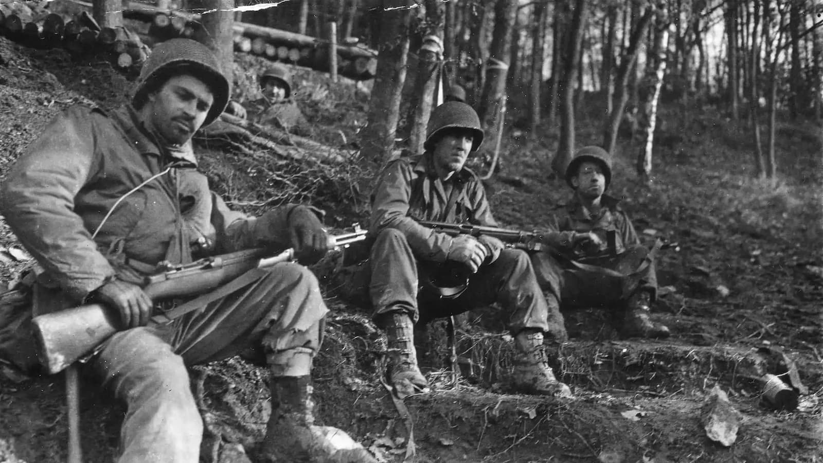 Weary U.S. infantrymen resting on a slope in the Hürtgen Forest during heavy fighting, November 1944. A long and unforgiving battle, it is an important stop in understanding the upcoming Battle of the Bulge on our 85th Anniversary tour.