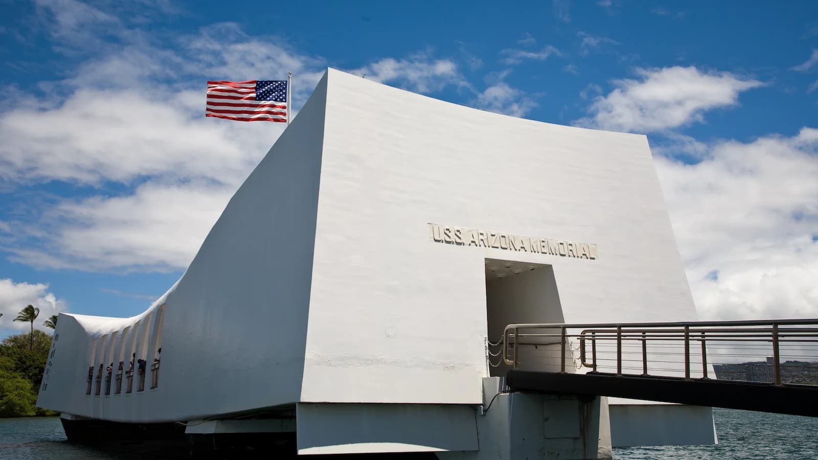 USS Arizona Memorial hovering above the sunken battleship at Pearl Harbor, a powerful experience on Essential History Expeditions’ Pearl Harbor history tour.