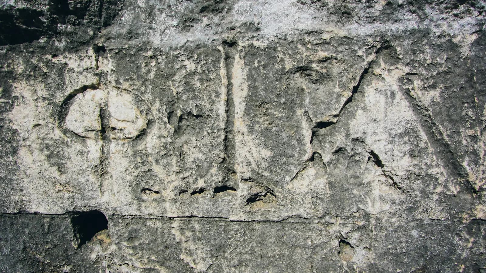 Close-up of ancient Greek stone carvings at the Theater of Neapolis in Siracusa, highlighting Sicily’s rich classical heritage.