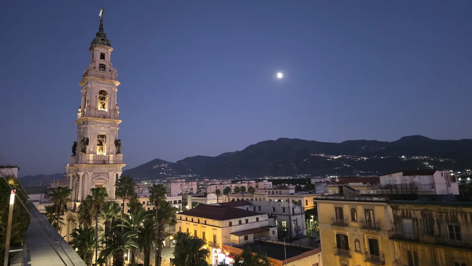 Late evening view of the Neo-Baroque bell tower of the the Pontifical Shrine of the Blessed Virgin of the Rosary of Pompei from the rooftop of the Habita 79 , one of the hotels on our Road to Rome tour.