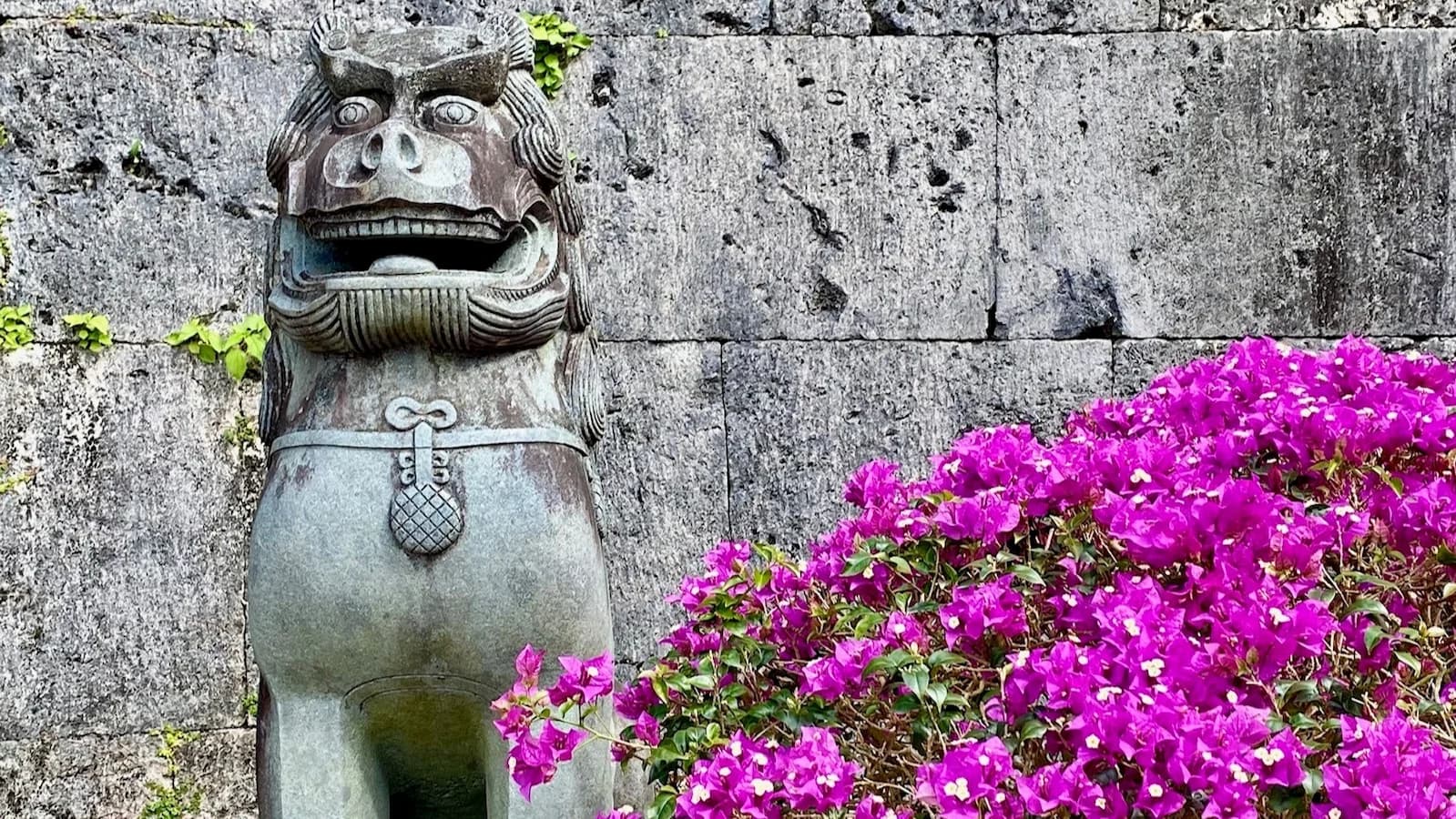 Traditional Shisa statue in garden in Okinawa, Japan