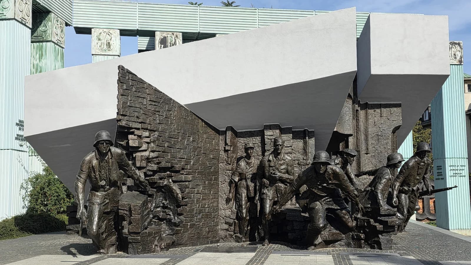 Dramatic sculptural relief at the Warsaw Uprising Monument depicting Polish fighters during the 1944 battle for the city.