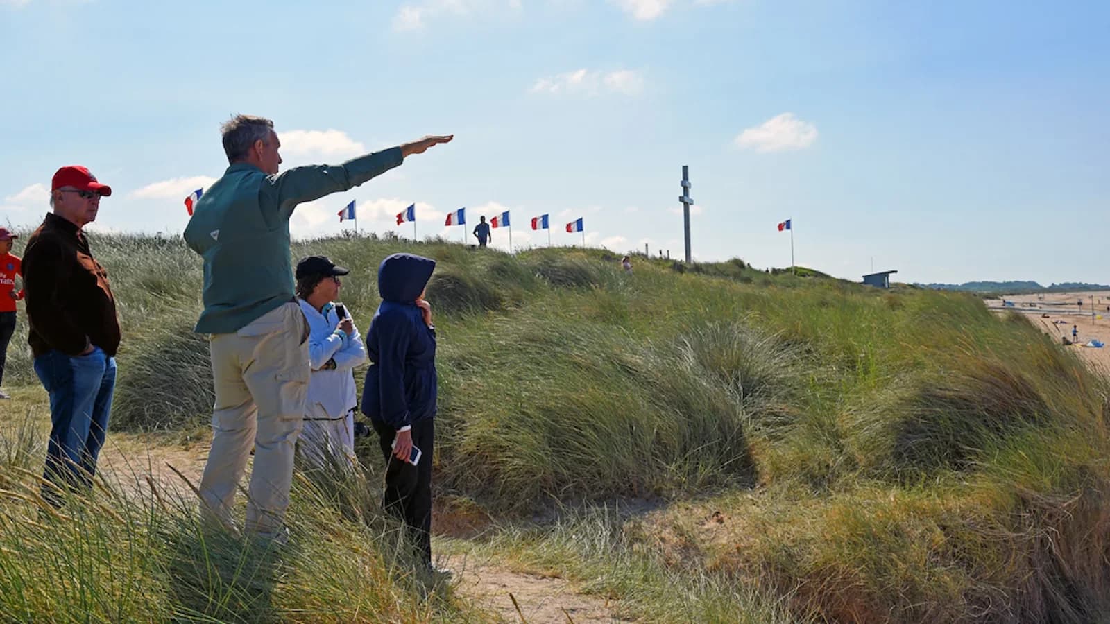 Dr. Brian DeToy guides an Essential History Expedition group on JUNO Beach covering actions on D-Day in Normandy.