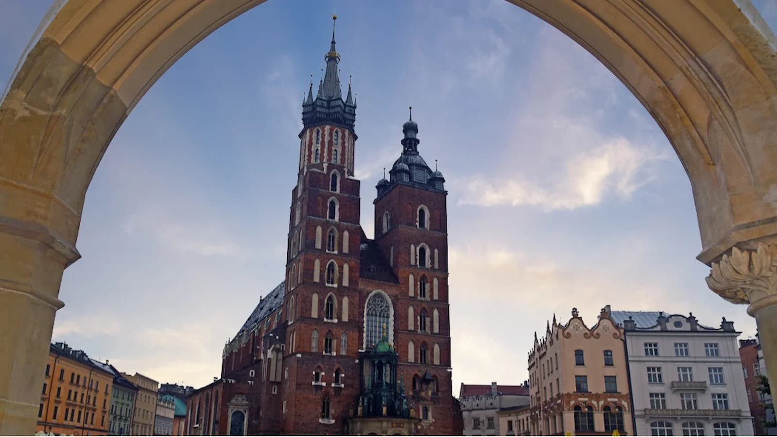 View of St. Mary’s Basilica through an archway in Krakow’s Main Square, a highlight of Poland’s historic former capital.