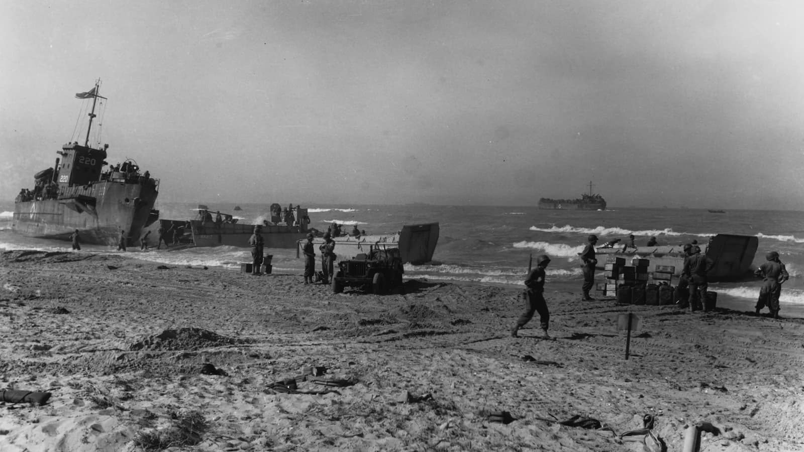 American troops and landing craft on the beaches of Gela, Sicily, during the Allied invasion in Operation Husky, July 1943. Iconic image from the opening days of the Sicily campaign featured on our Road to Rome tour.