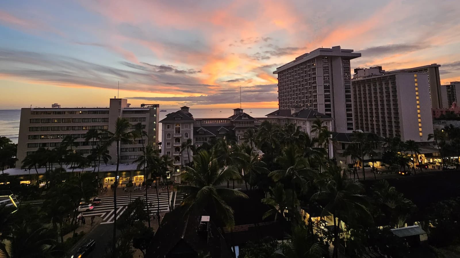 Spectacular sunset over Waikiki and the historic Moana Surfrider Hotel, home base for Essential History Expeditions’ Hawaii Pearl Harbor history and culture tour.