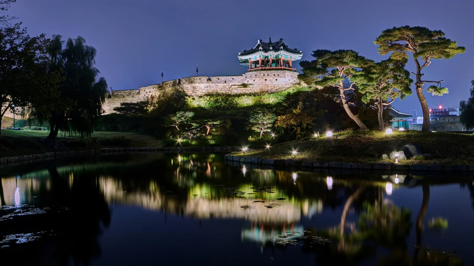 Suwon Hwaseong Fortress illuminated at night, a magnificent UNESCO World Heritage Site and pinnacle of Joseon Dynasty military architecture, visited on Essential History Expeditions’ Essential Korea tour.