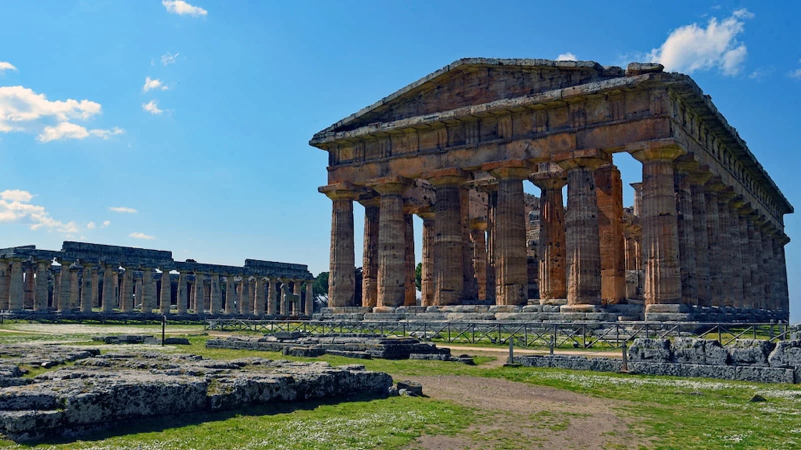 Ancient Greek temples at Paestum, one of the best-preserved Magna Graecia archaeological sites in Italy. These exceptionally well-preserved Doric temples date back over 2,500 years.
