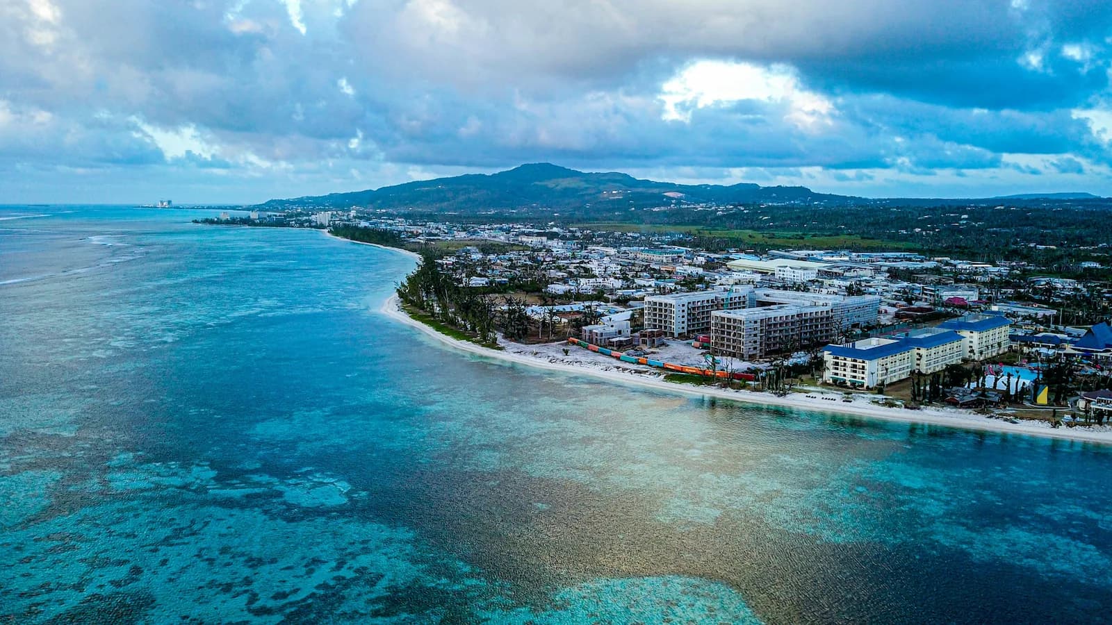Aerial view of Garapan and the western coastline of Saipan in the Mariana Islands. Site of intense fighting during the 1944 Battle of Saipan and a key location on our The Return: America in the Pacific, 1944-45 expedition.