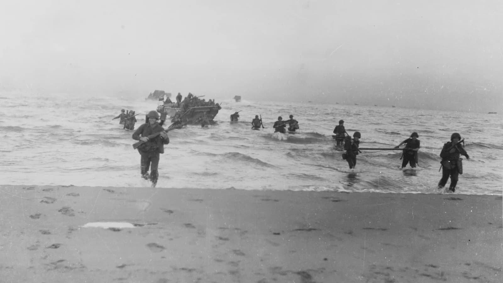 American soldiers of the 143rd Infantry Regiment coming ashore at Salerno, Italy, as part of Operation Avalanche in 1943.