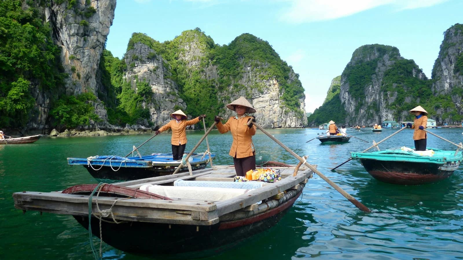 Dramatic seascape of Halong Bay with traditional junk boats among towering limestone formations. A highlight of our cultural and scenic immersion in northern Vietnam.