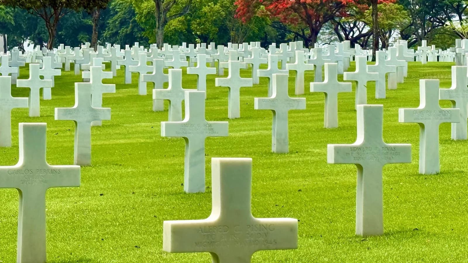 Rows of white crosses at the Manila American Cemetery, the largest American overseas military cemetery, commemorating those who fell in the Pacific Theater during Essential History Expeditions’ WWII tour.