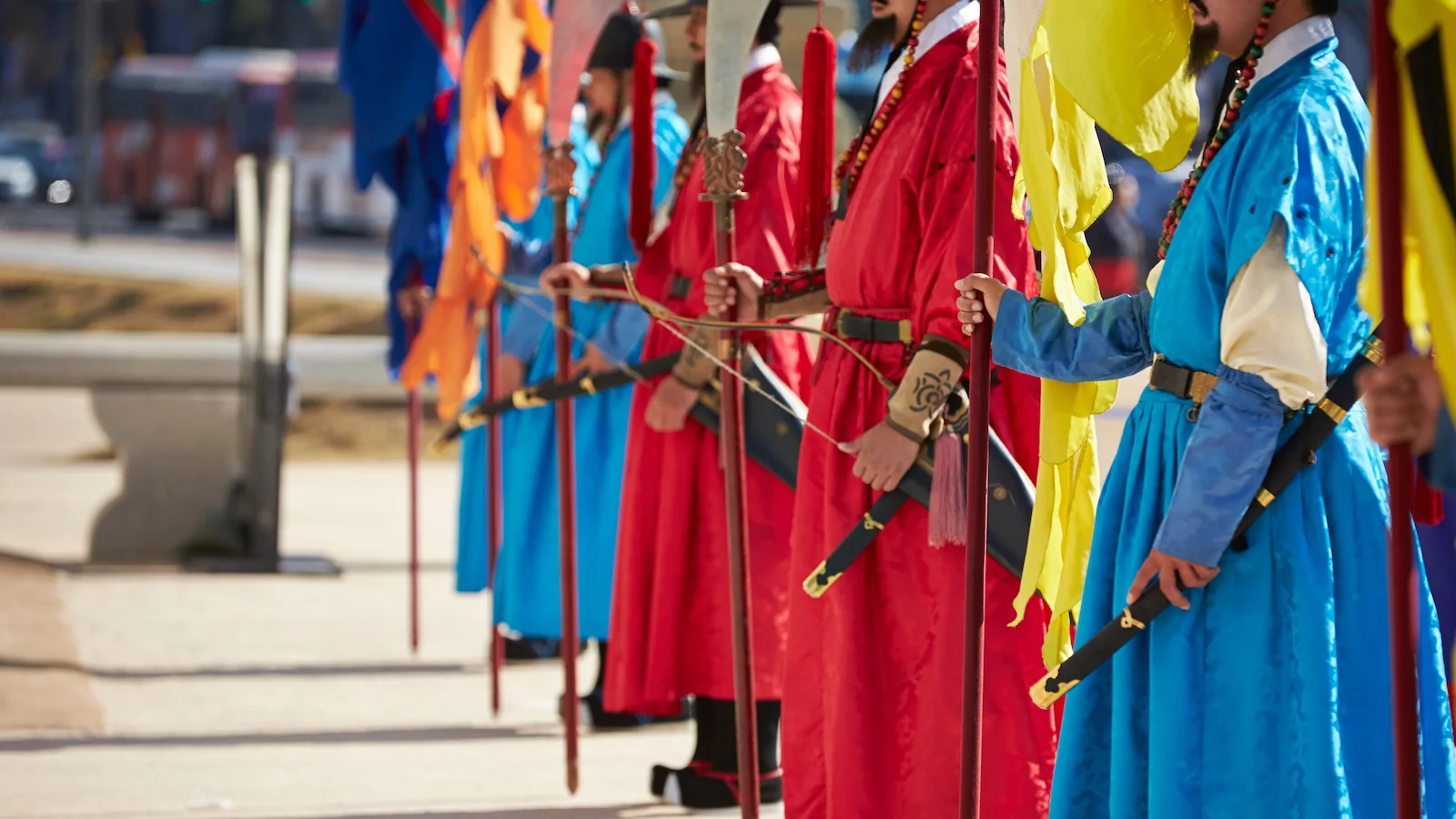 Traditional Joseon Dynasty royal guards in vibrant hanbok standing in formation, representing Korea’s rich cultural heritage on Essential History Expeditions’ Essential Korea tour.