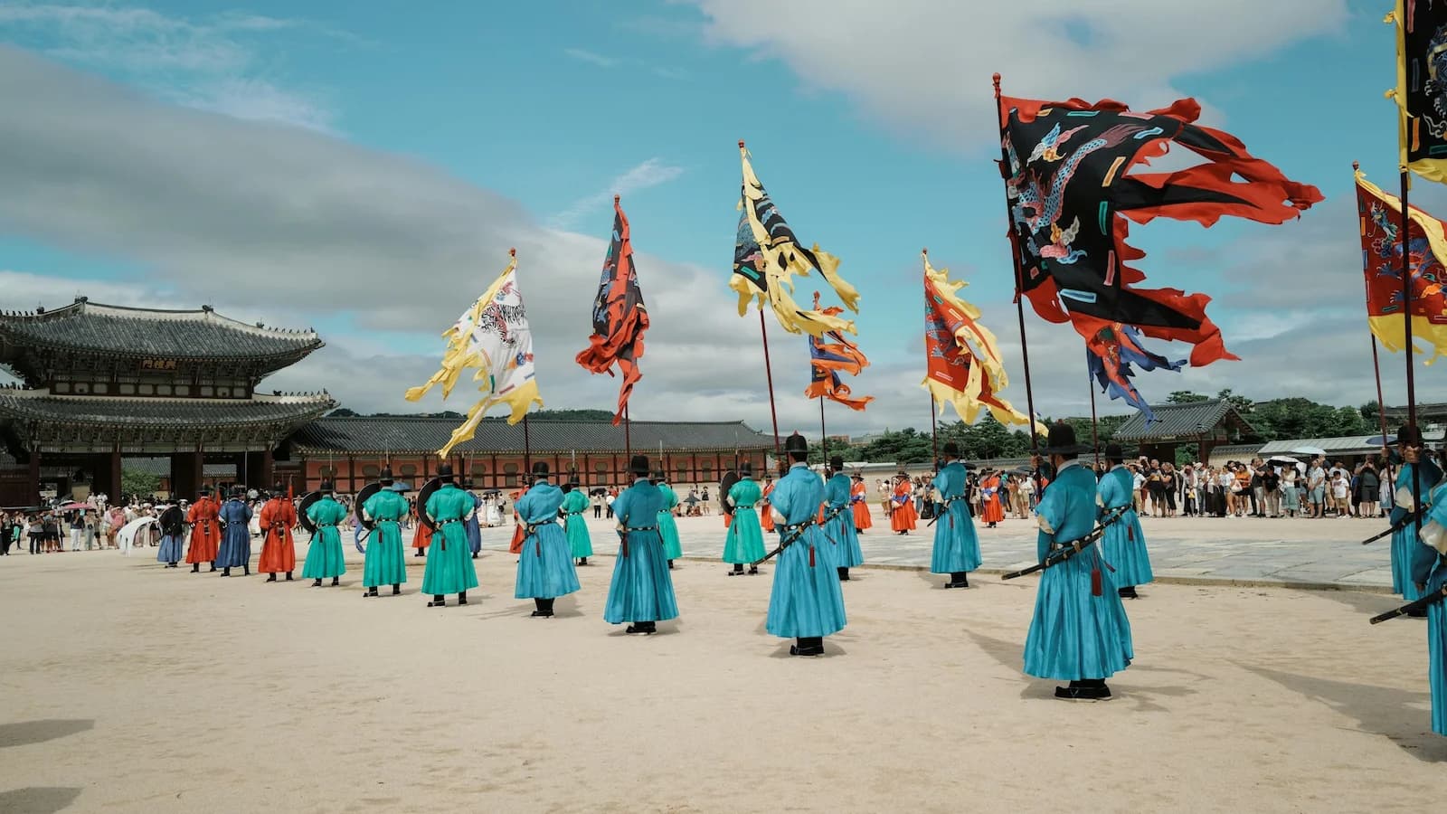 Traditional Joseon Dynasty royal guards in colorful hanbok performing at Gyeongbokgung Palace in Seoul, a highlight of Korean cultural heritage on Essential History Expeditions’ Essential Korea tour.